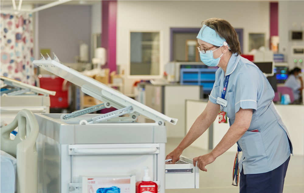 Nurse opening drawer on an Agile Medical chart top trolley