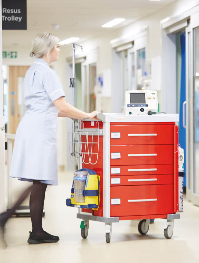 Female worker pushing Resus Connect trolley